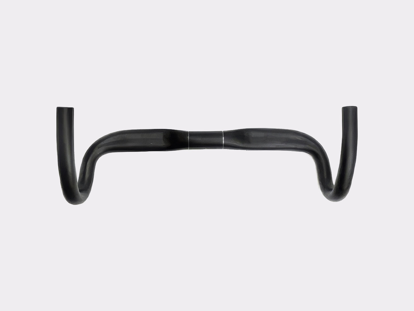 Vue de profil montrant la géométrie compacte avec un reach de 90 mm et la courbure constante du drop.