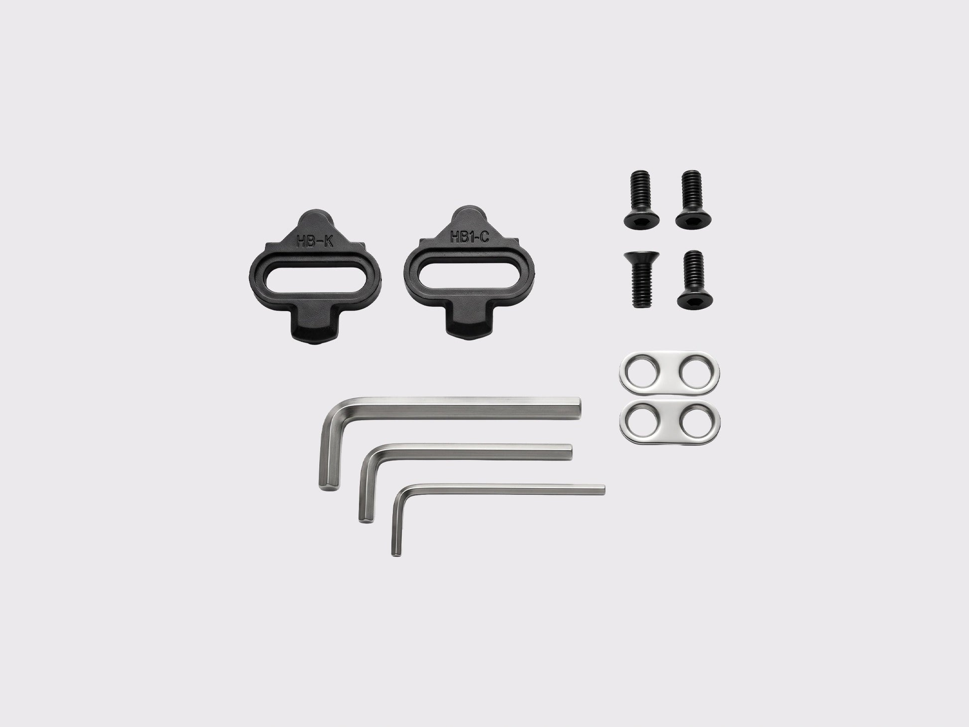 Contenu du pack Racework SPD-Plate comprenant les cales type SPD, la visserie de fixation et les clés Allen pour le montage et le réglage de tension.