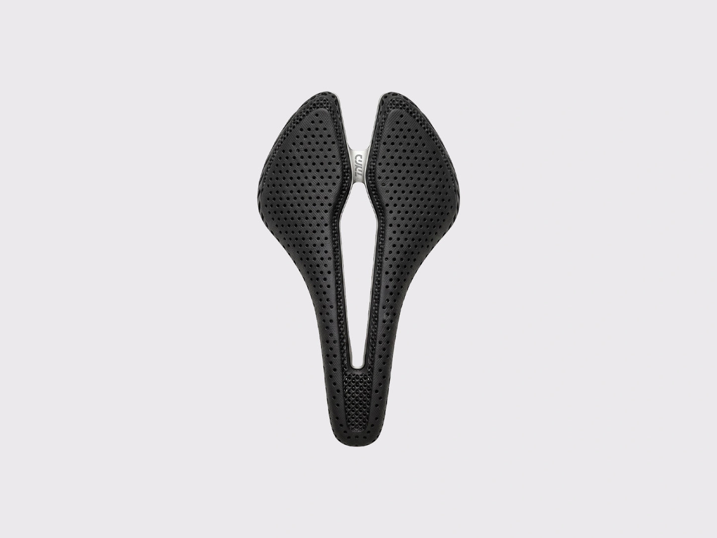 Selle Titane CYKL ERGO 3D Ti : vue de dessus mettant en évidence le rembourrage 3D lattice et le canal central évasé pour la décharge périnéale en ultra-distance.